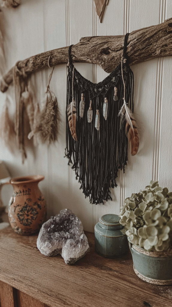 Rustic wall decor with black macrame, hanging feathers, crystals, and amethyst alongside decorative pottery and plants.