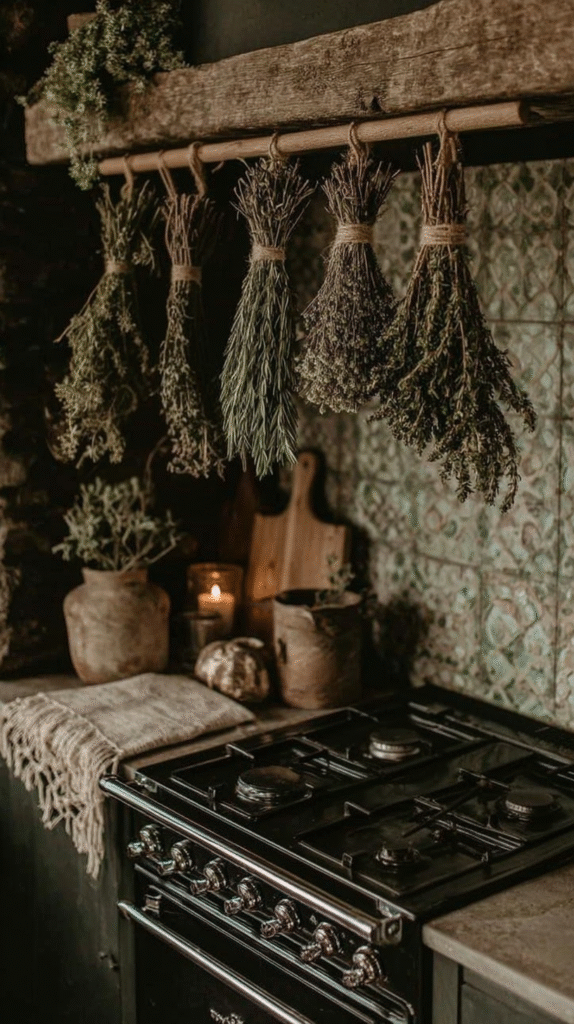 Rustic kitchen with herbs hanging above a vintage stove, enhancing a cozy, natural ambiance.